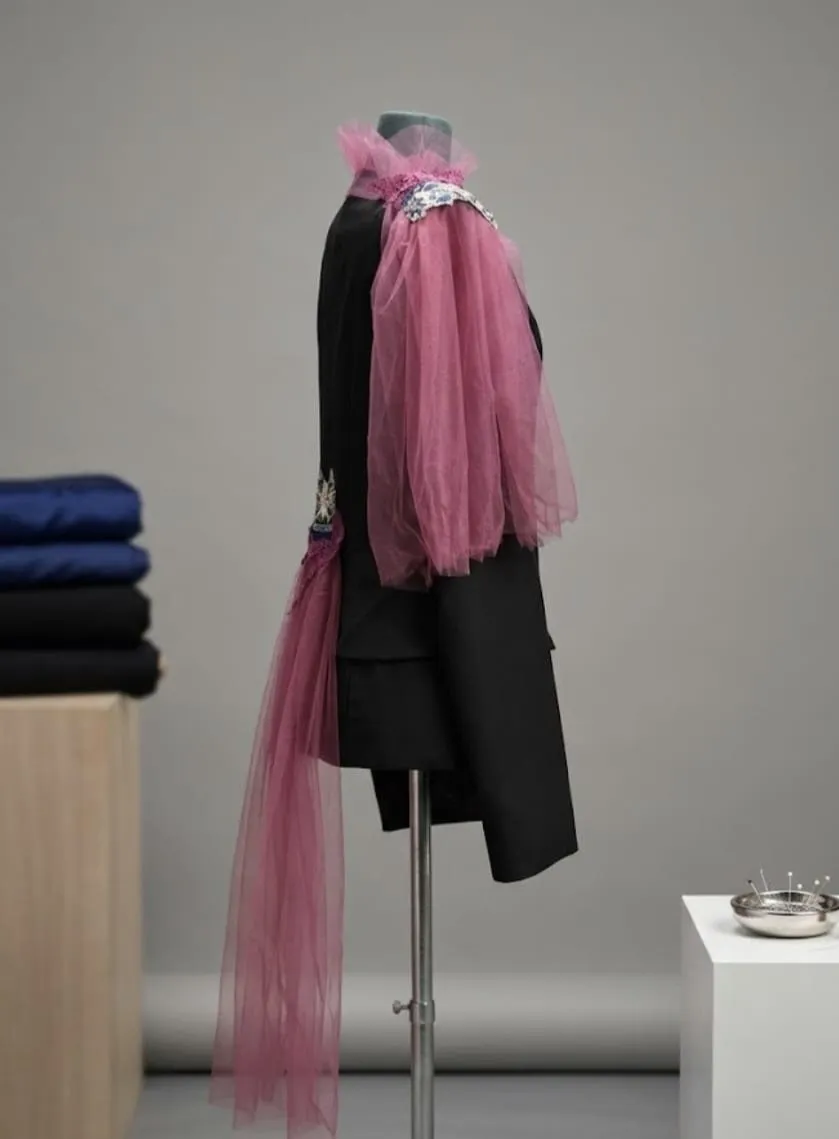 Black jacket redesigned with a cascade of pink tulle